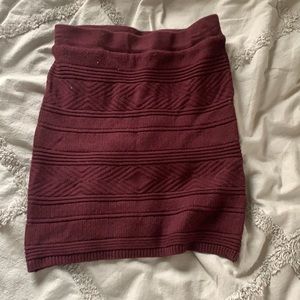Tight maroon skirt.